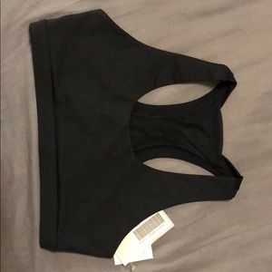 Medium JustFab black sports bra with crossed back